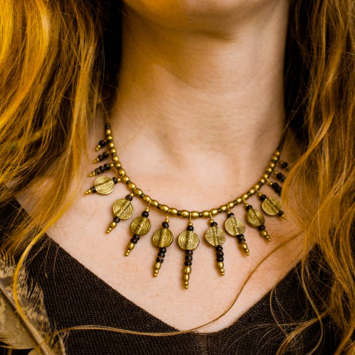 Statement sun necklace with leather, brass charms and beads for wholesale by Nomadu