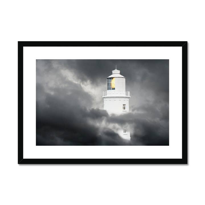 Lighthouse in storm clouds Stampa incorniciata e montata per la vendita all'ingrosso da parte di Sorbey