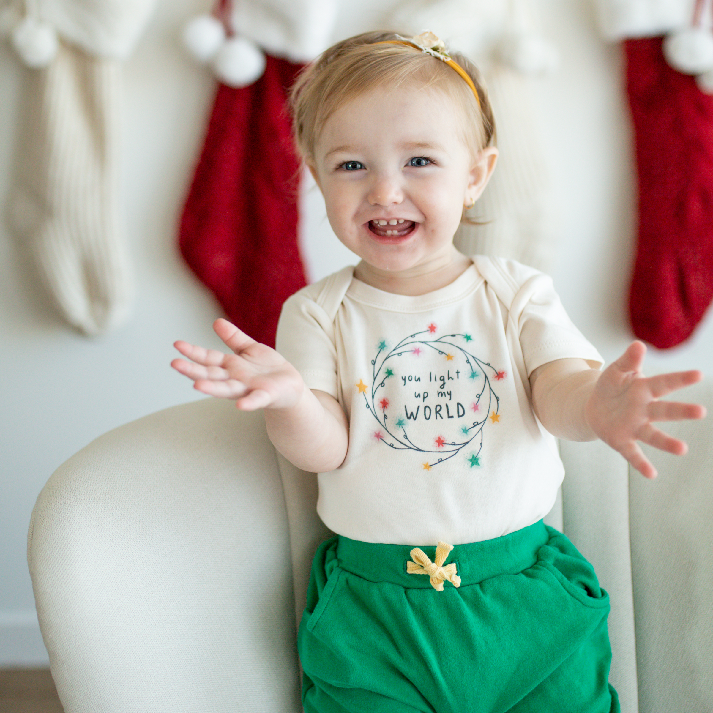 Default Christmas baby graphic organic bodysuit | light up my world for wholesale on Faire2