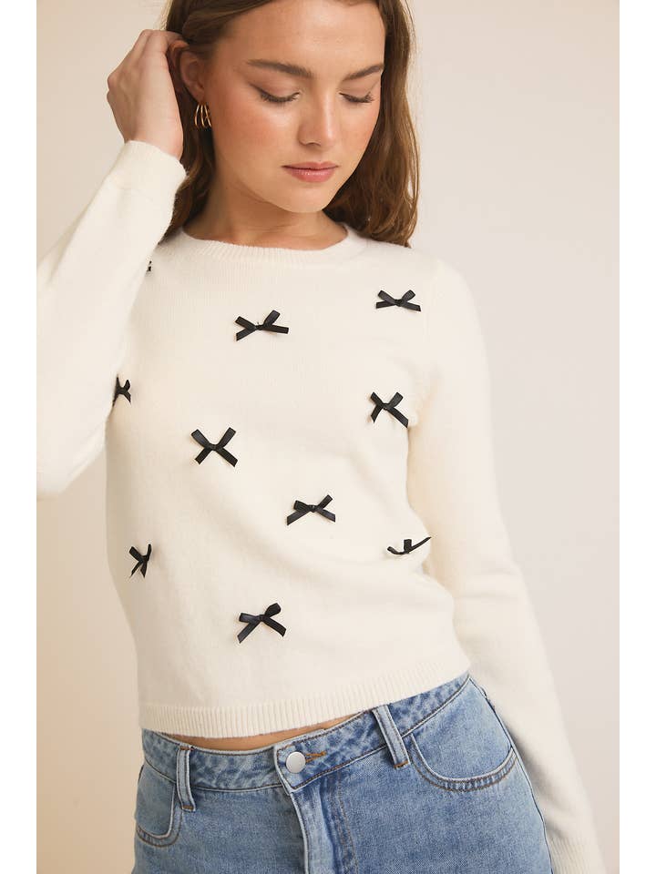 CREAM ROUND NECK LONG SLEEVE BOWS ON FRONT SWEATER for wholesale on Faire