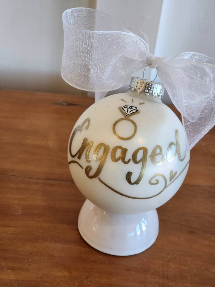Just Engaged hand painted glass ornament for wholesale by Kirsten in Color