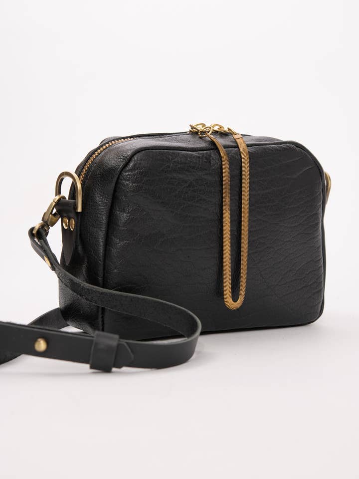 Leather crossbody bag and brass charm CARTIER model for wholesale by Veinage