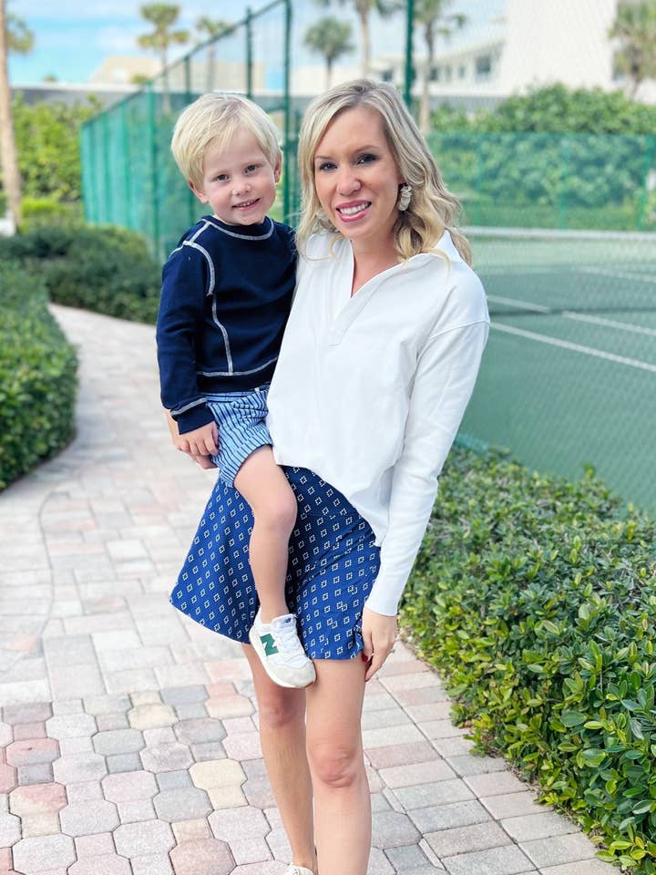 El polo Shea en color SuperSoft White para venta al por mayor de Duffield Lane