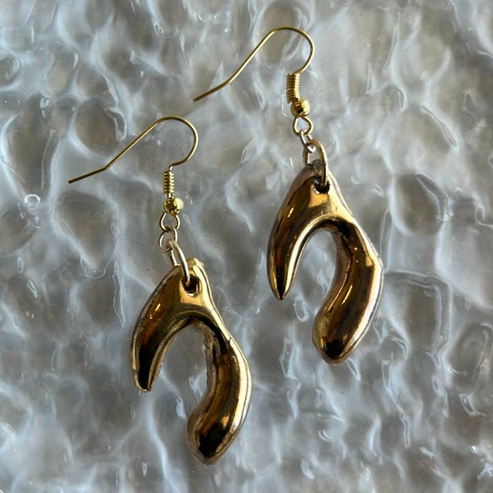 Handmade Gold Wishbone Dangle Earrings for wholesale by Nala Studio