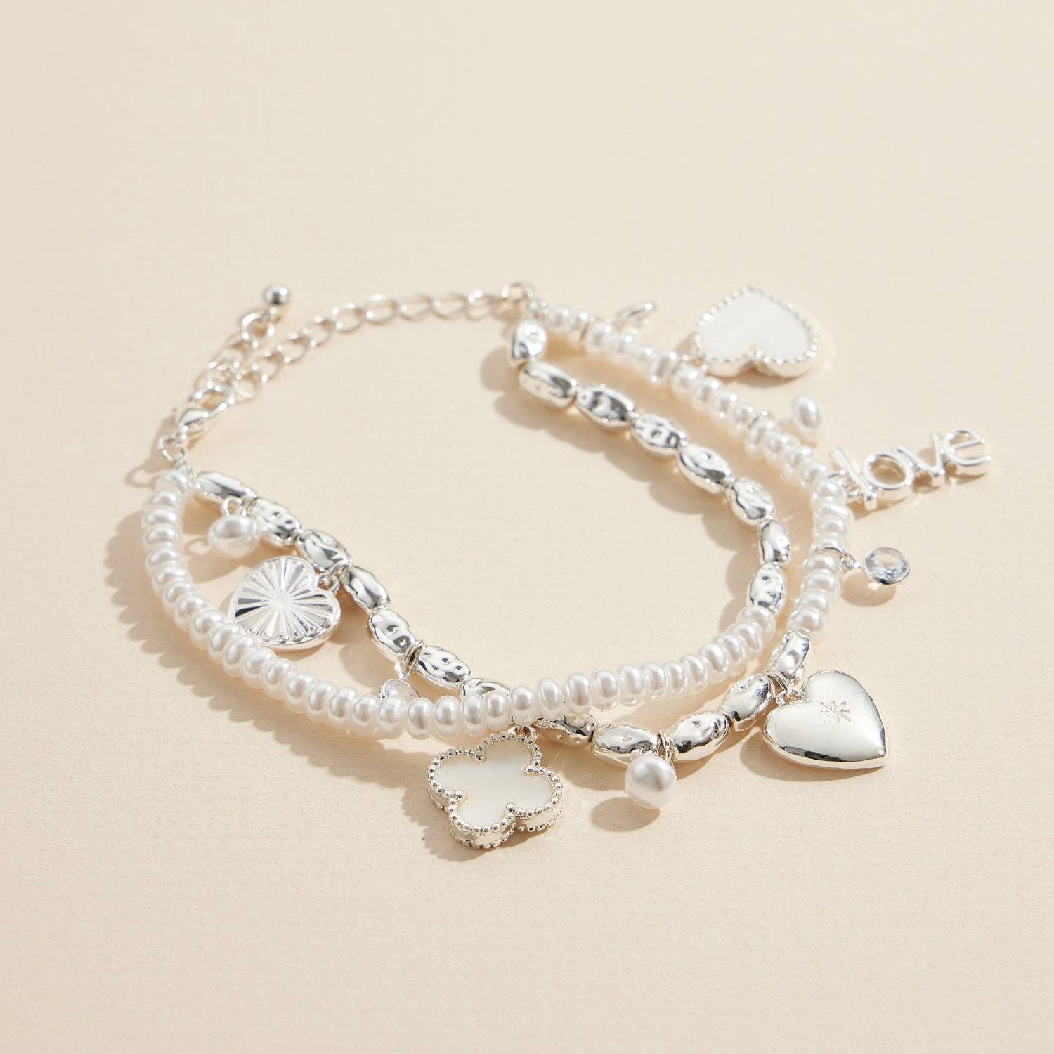 Lilla Haven - Wholesale Charm/Dangle Bracelet - Layered Pearl Charm Bracelet – Love, Heart, and Clover Pendants1