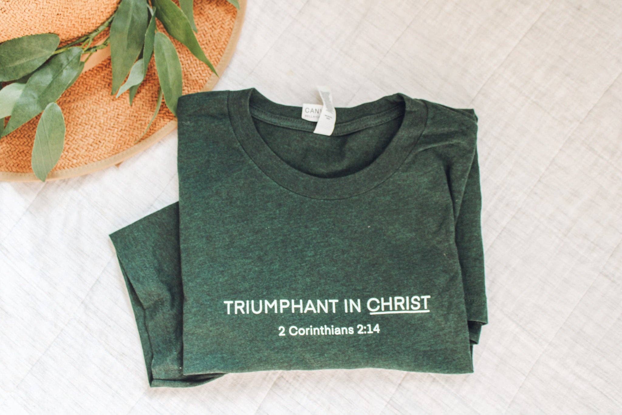 Common Grace Print Shop - Wholesale Screen Printed T-Shirt - Women's - Triumphant in Christ UNISEX Short-Sleeve T-Shirt (Color: Heathered Emerald)0