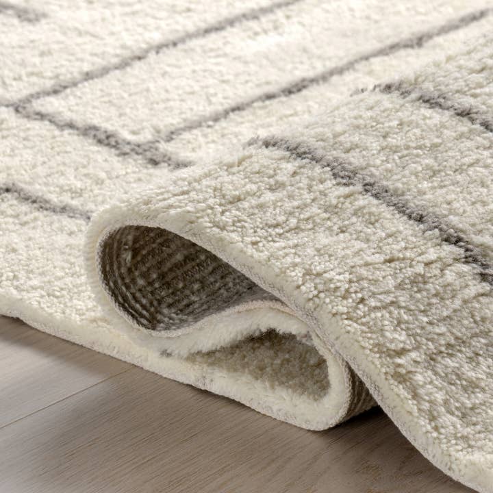 Ivory Frenshe Interiors x Rugs USA Outpost Graphic Area Rug for wholesale on Faire