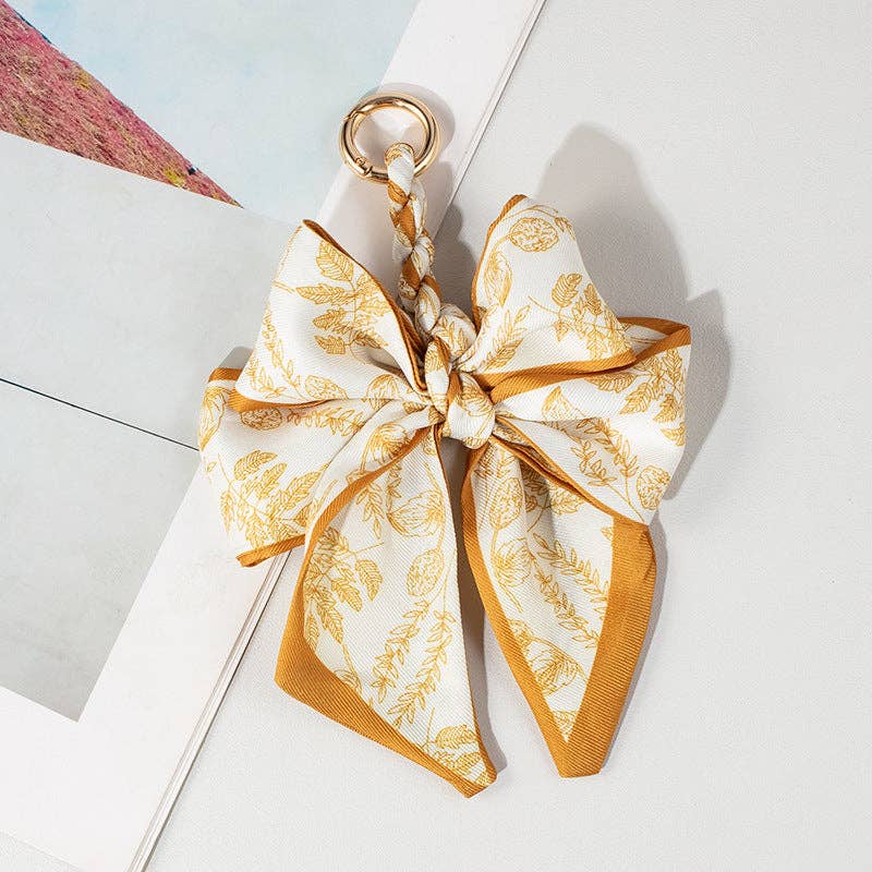 Dipped Shop - Vendita all'ingrosso Accessorio per borsetta - Donna - Ciondolo per Borsa con Fiocco e Stampa di Pizzo Vintage DP25D6764