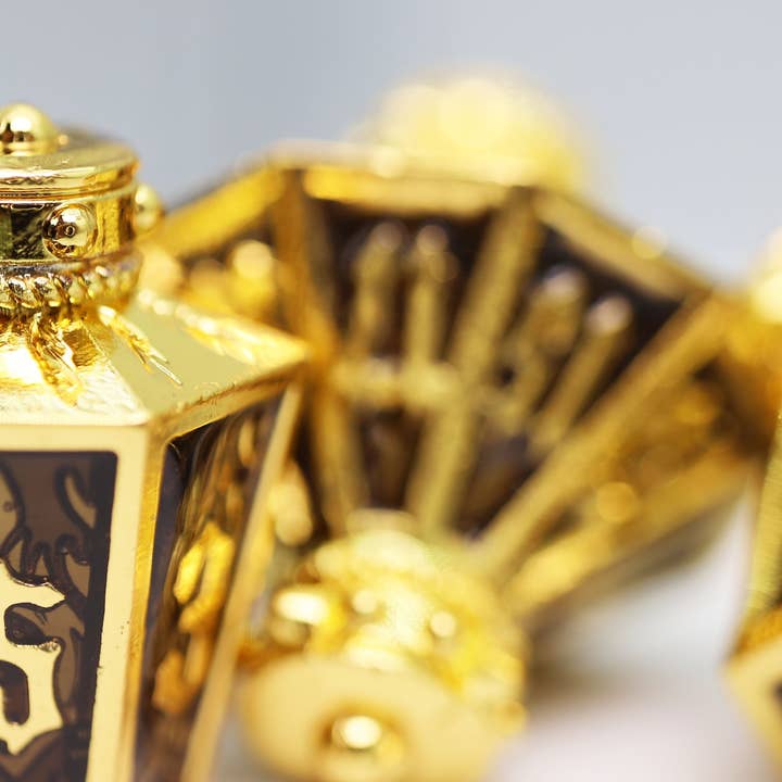 Foam Brain Games - Wholesale Dice - Moonlit Lantern: Golden Earthen Flame - Metal RPG Dice Set4