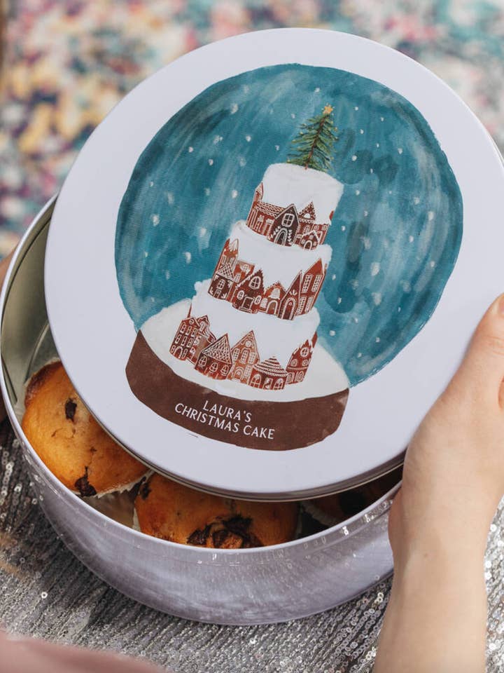 Personalised Snow Globe Christmas Cake Tin for wholesale by CloudsandCurrents