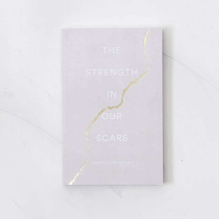 The Strength In Our Scars - book and other Purchase Wholesale ravi book. Free Returns & Net 60 Terms on Faire trending on Faire.