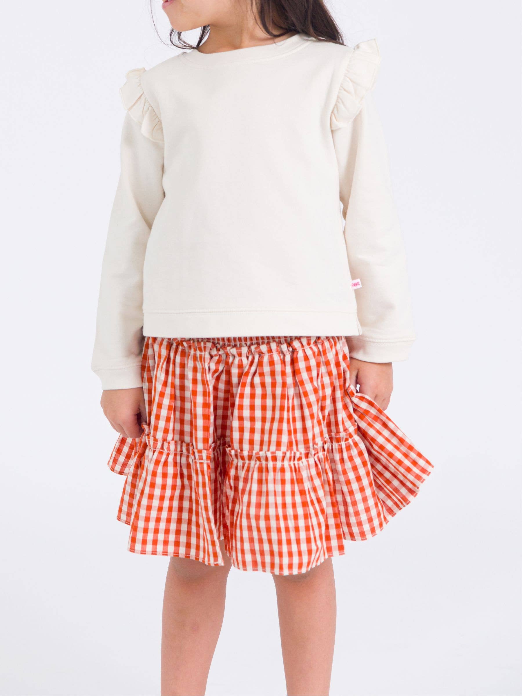 Orange Girls Classic Rust Gingham Smocked Twirl Skirt for wholesale on Faire1