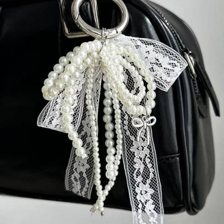 Lace Bow Pearl Keychain Bag Charms DP25B558 and other Purchase Wholesale bow keychain. Free Returns & Net 60 Terms on Faire trending on Faire.