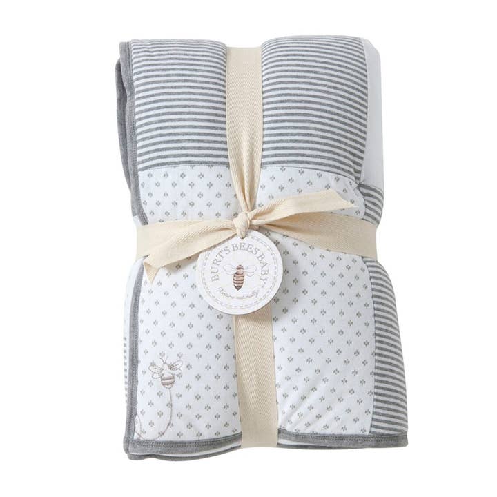 Heather Grey Dottie Bee Organic Cotton Reversible Baby Quilt for wholesale on Faire