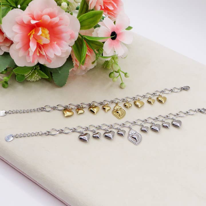 AURELIE SACRED ~ Bracciale ACCIAIO INOSSIDABILE con maxi cuore sacro e cuori bombe' chiama angeli and other Purchase Wholesale accesorios para hacer pulseras. Free Returns & Net 60 Terms on Faire trending on Faire.