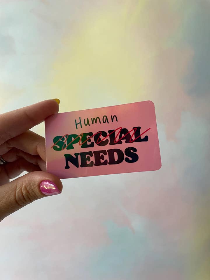Autocollant holographique étanche en vinyle "Human Needs" pour la vente par Steele Creative Co