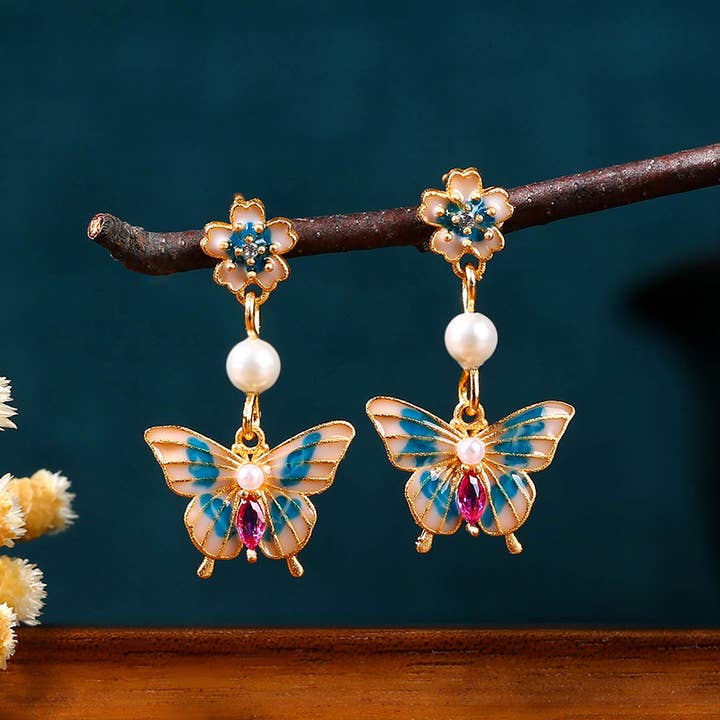 Bright MacMing - Venta al por mayor Pendientes colgantes - Pendientes de mariposas voladoras blancas y azules