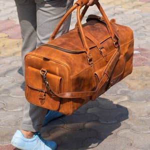 Purchase Wholesale Leather Duffle Bag. Free Returns & Net 60 Terms on Faire.com