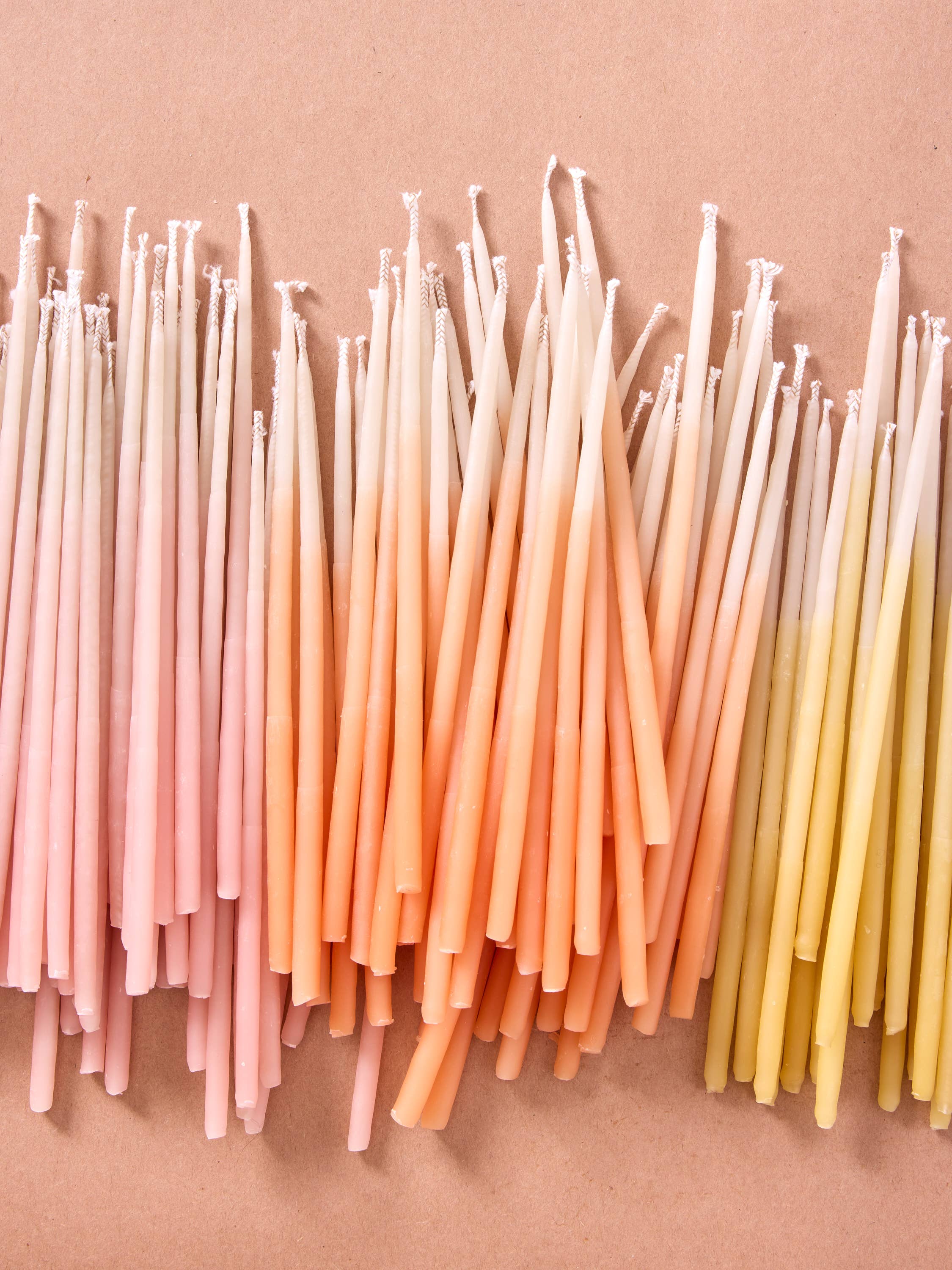 Assorted Ombre Hand-dipped Beeswax Birthday Candles | Tall Rainbow Ombré for wholesale on Faire3