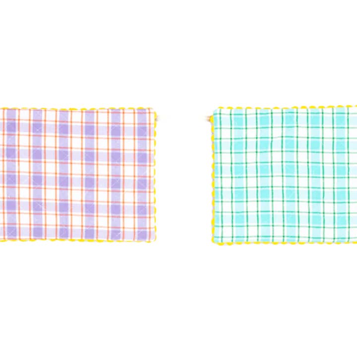 Een paar omkeerbare placemats van Aqua en Orchid voor wholesale door Domenica Marland