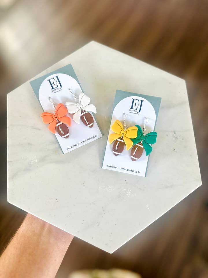 Custom Bow Football Dangles for wholesale by EJ Clay Co