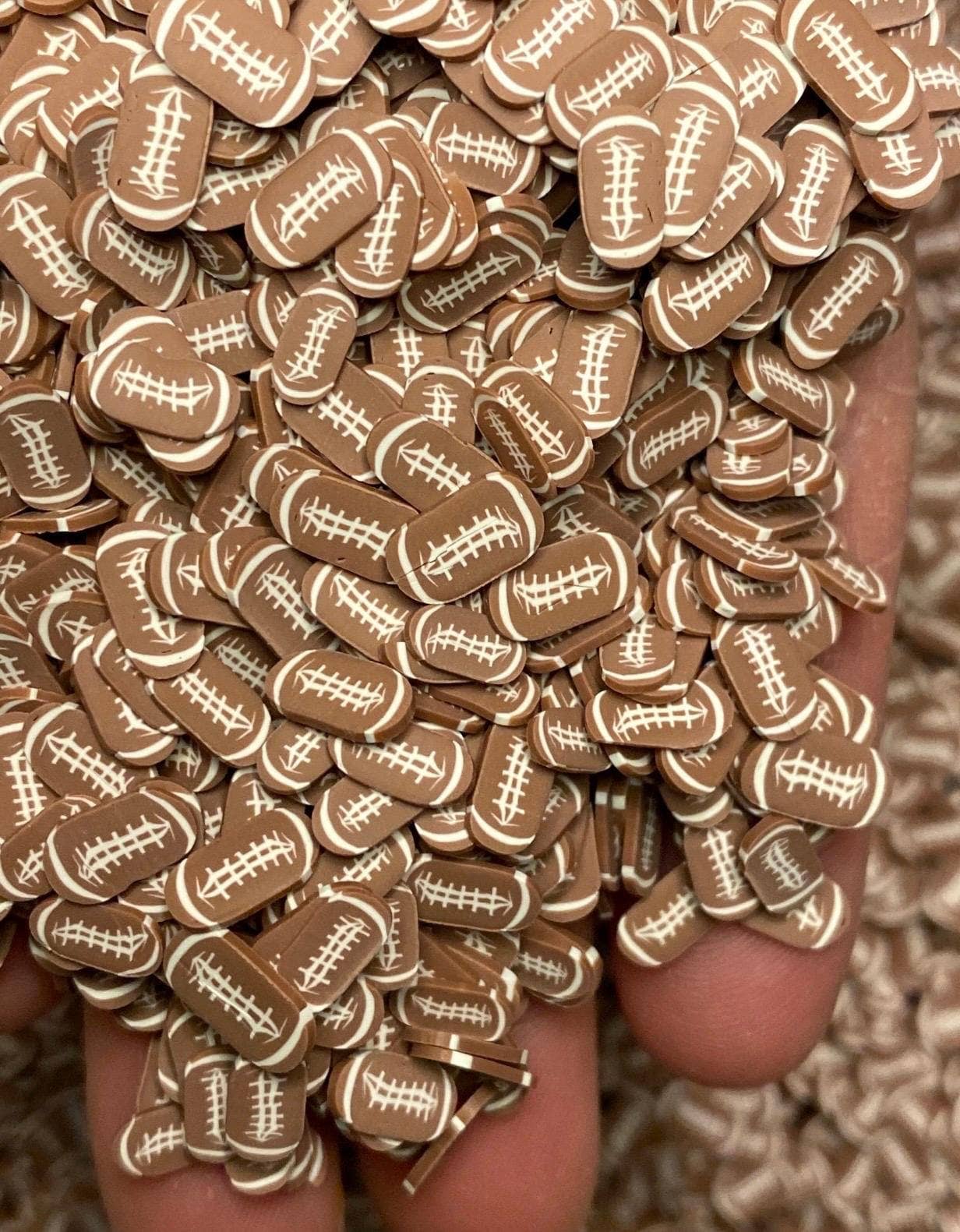 ASAP Craft Supplies - Wholesale Craft Supplies - Football Polymer Clay Slices 5mm.  0.5 oz bag1