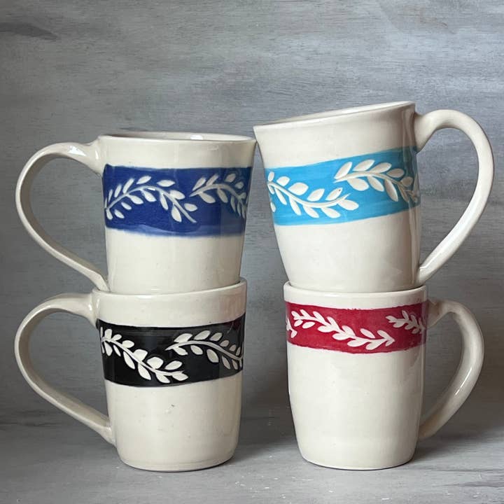 White Handmade Ceramic Mug with Hand Carved Leaf motif for wholesale by JeLO Designs Pottery