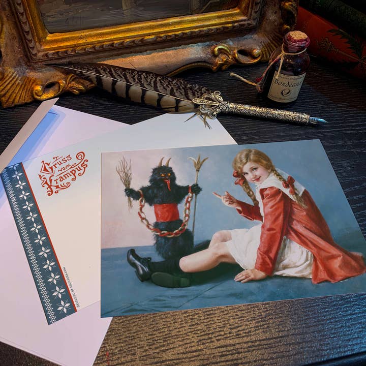 Bambina e bambola Krampus, biglietti di Natale con buste per la vendita all'ingrosso da parte di Ebon et Noir LLC