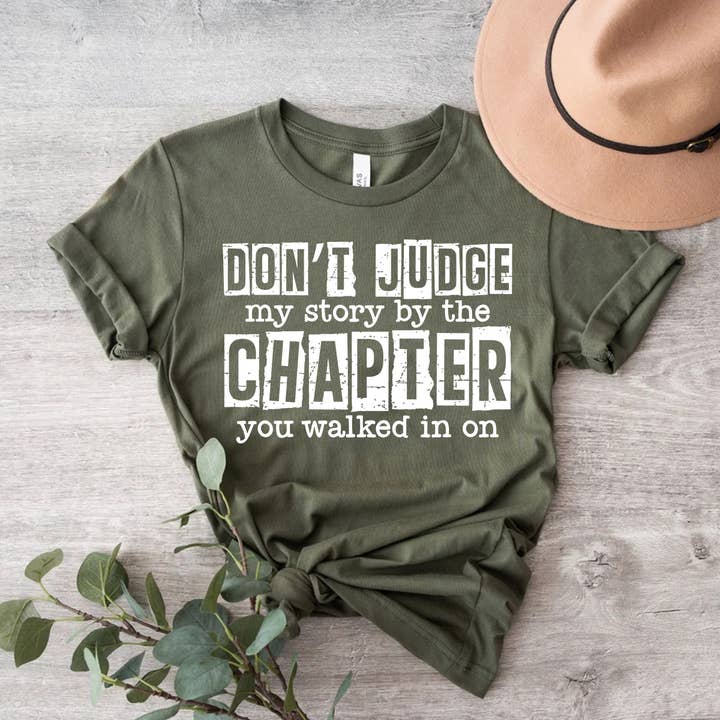 Don't Judge My Story By The Chapter Shirt | Mom T-shirt and other Purchase Wholesale mom i want to hear your story. Free Returns & Net 60 Terms on Faire trending on Faire.
