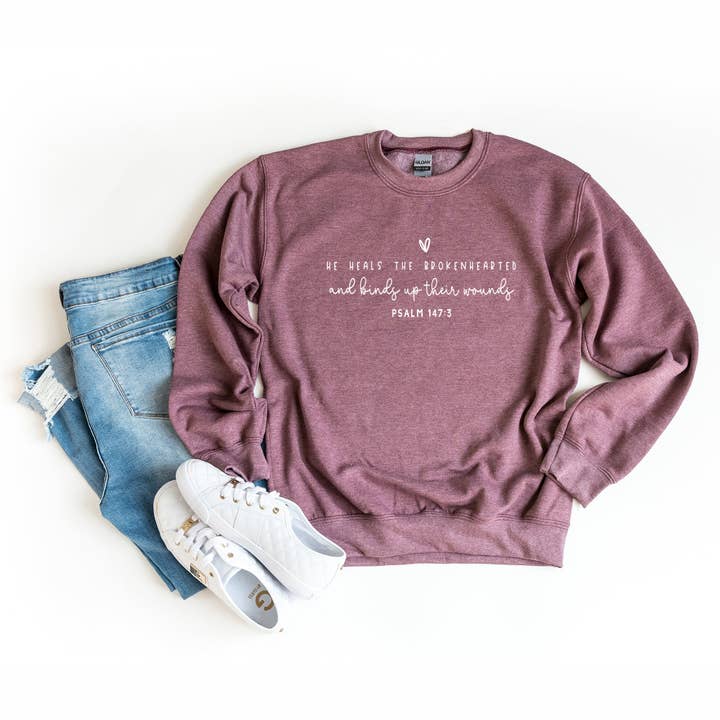 He Heals The Brokenhearted | Sweatshirt for wholesale by Uplifting Threads Co Wholesale