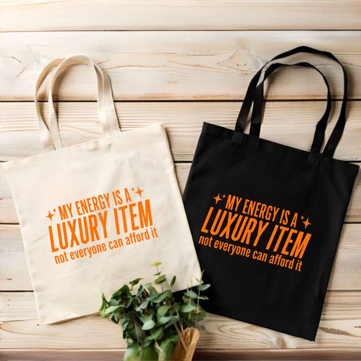 Energy is a Luxury Tote Bag | The Life of | Taylor for wholesale by brattybloom