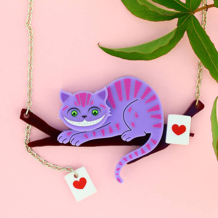 Rosa/ Violett Halskette „Alice im Wunderland“ mit Cheshire-Katzenzweig für den Großhandel auf Faire