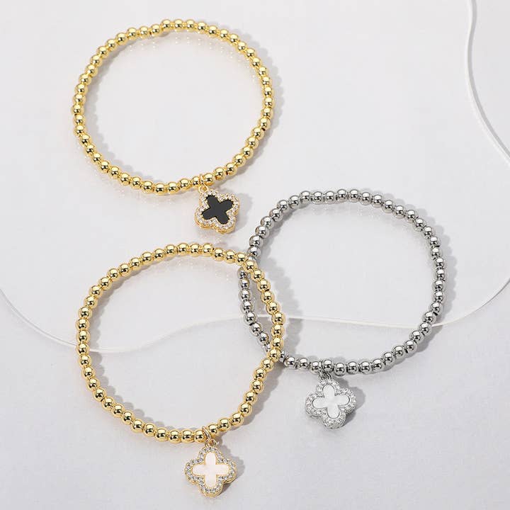 Reversible Stainless Steel Quatrefoil Charm Stretch Bracelet for wholesale by Sensibling Corp.