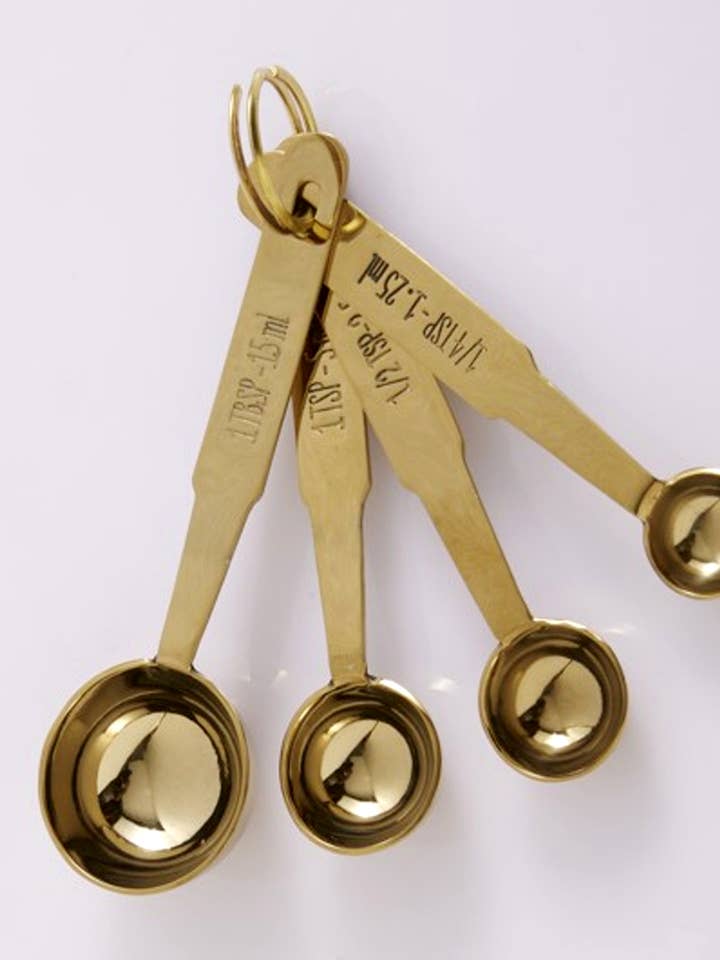 Set of Four Measuring Spoons - Brass Coated -Gifts and other Purchase Wholesale samantha. Free Returns & Net 60 Terms on Faire trending on Faire.