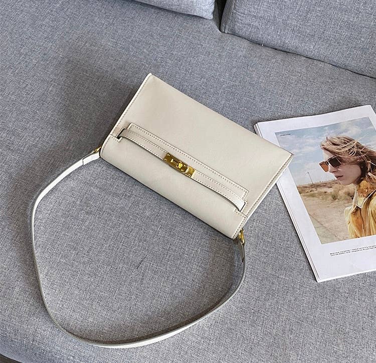 Sook Stainable - Vendita all'ingrosso Tracolla - Donna - Borsa a tracolla a busta in vera pelle con chiusura metallica10