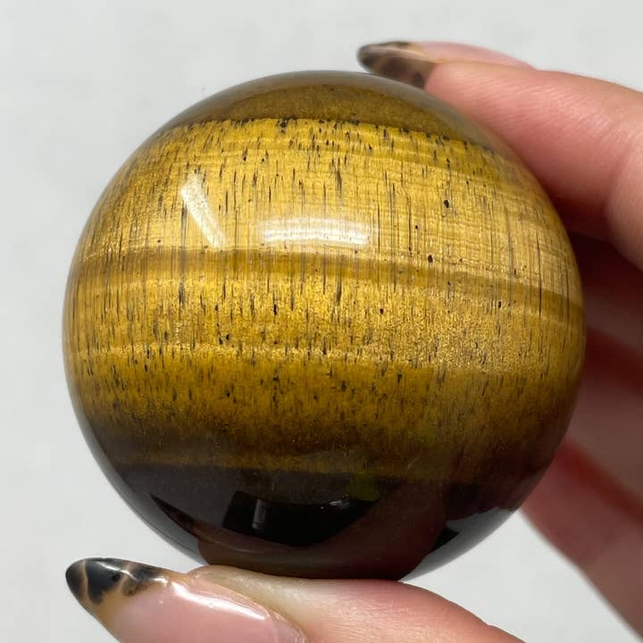 Tiger Eye Sphere for wholesale by The Crystal Tabby