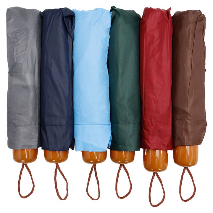 SURTIDO Paraguas compacto manual sólido de 8 paneles y 3 pliegues de venta al por mayor en Faire9