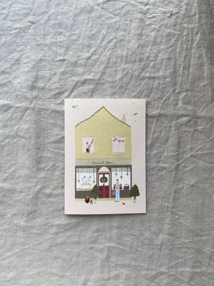 Um cartão de Natal da Loja Festiva por atacado de Harriet Watson