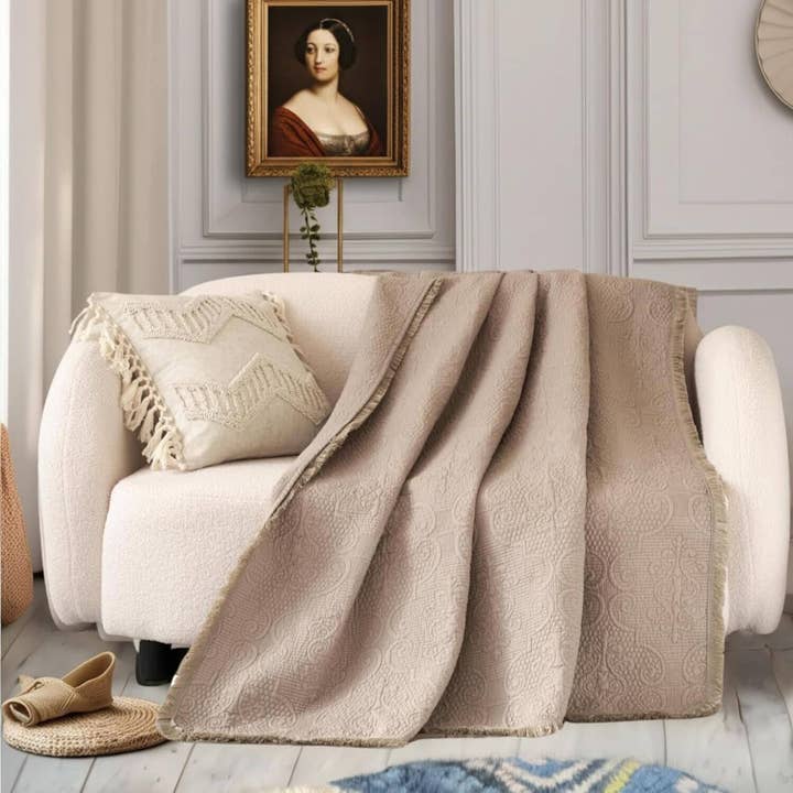 DaDa Bedding Elegant Fringed Cotton Quilted Throw Blanket - Luxurious Solid Soft Paisley Pattern, Cozy Lightweight Lap Throw, Perfect for Couch or Bed, Neutral Sandy Taupe Tan Beige, 50x60 Inches for wholesale by DaDalogy Bedding