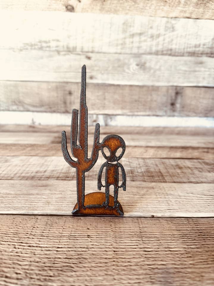 Alien with Cactus Rustic Metal Area 51 Doodad Figurine for wholesale by Universal Ironworks USA