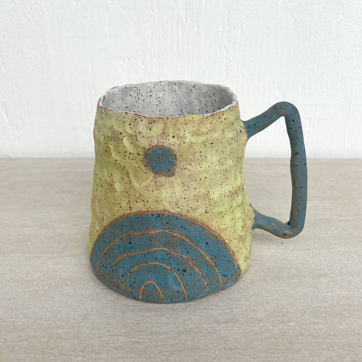 Abstracte mok met de zon boven voor wholesale door Honey & Luster