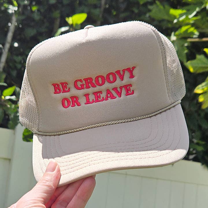 Be Groovy or Leave Trucker Hat in Tan and Pink for wholesale by Aloha Lovely