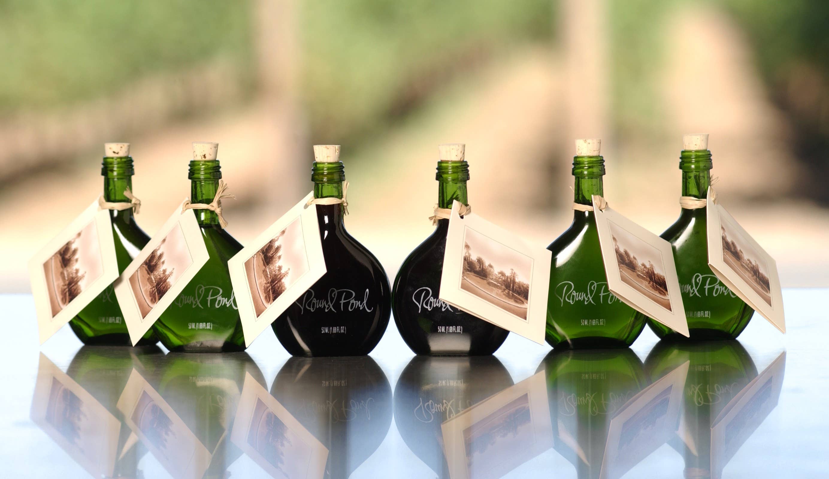 Round Pond Estate Winery - Venta al por mayor Aceite de oliva - Aceite de oliva infusionado con ajo botella mini de 50 mL0