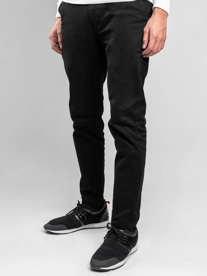 Pantalon élastique noir pour la vente par DANTE