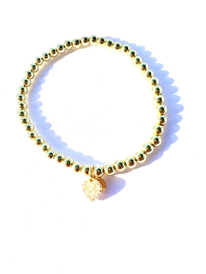 COURAGE | Gold stretch bead bracelet with CZ heart charm for wholesale by CHEEKYBOOM