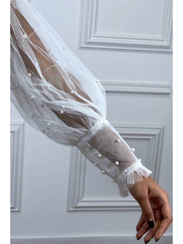 bianco Blusa bianca in tulle trasparente con perline a collo alto in vendita all'ingrosso su Faire