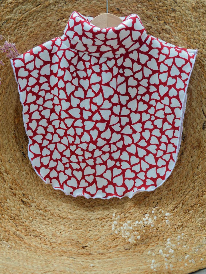 “A Flight of Hearts” poncho for wholesale by Un hibou dans le papier