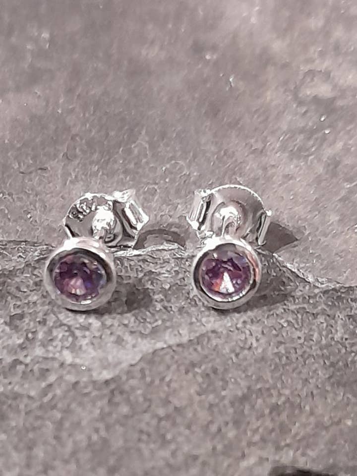 SS756B - PURPLE ROUND CZ 4MM STUD for wholesale by Bluelily925silver
