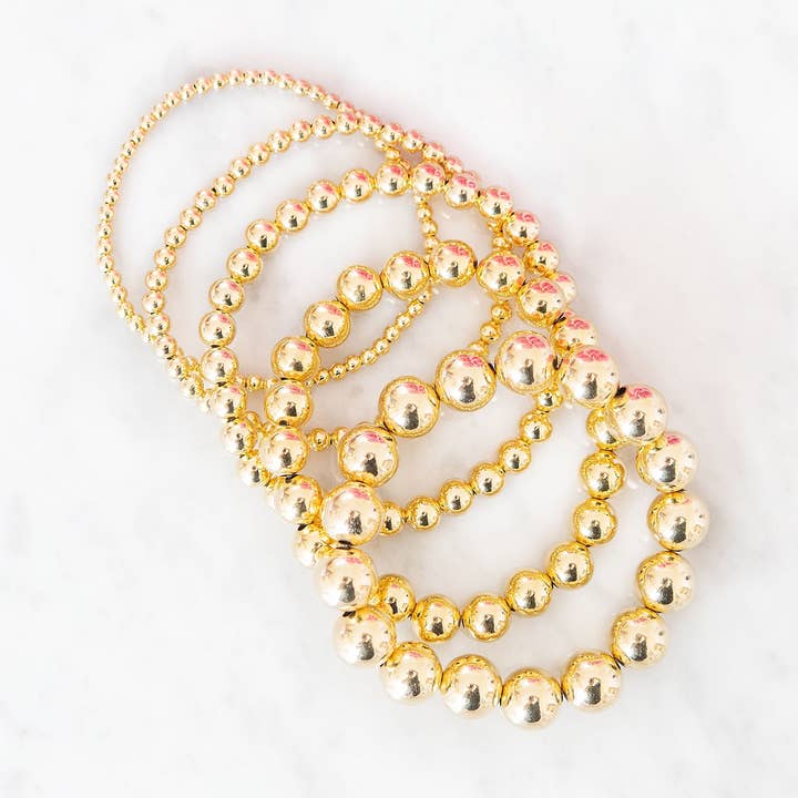 Graduerede guldfyldte guldperlearmbånd | Sæt med 5 for engroshandel hos Golden Thread