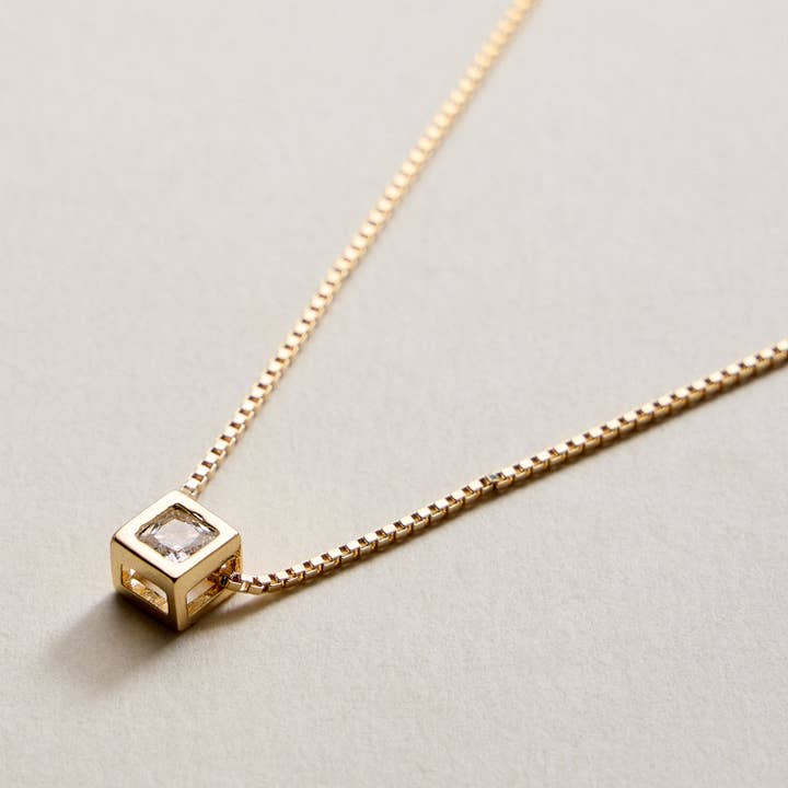 Gold Filled Box Chain Necklace with Geometric Cube Pendant and other Purchase Wholesale gold geometric centerpieces. Free Returns & Net 60 Terms on Faire trending on Faire.
